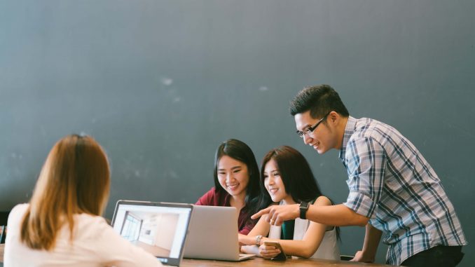 68273163-group-of-young-asian-business-colleagues-in-team-casual-discussion-startup-project-business-meeting-