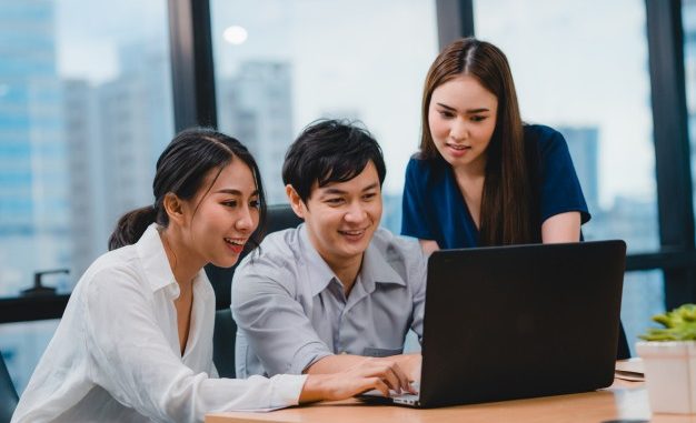 collaborative-process-multicultural-businesspeople-using-laptop-presentation-communication-meeting-brainstorming-ideas-about-project-colleagues-working-plan-success-strategy-modern-office_7861-2510